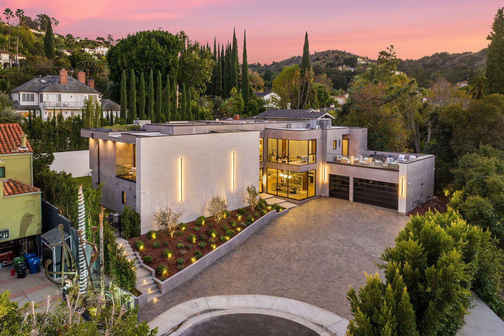 aerial-view-of-a-house-at-sunset-with-sparkling