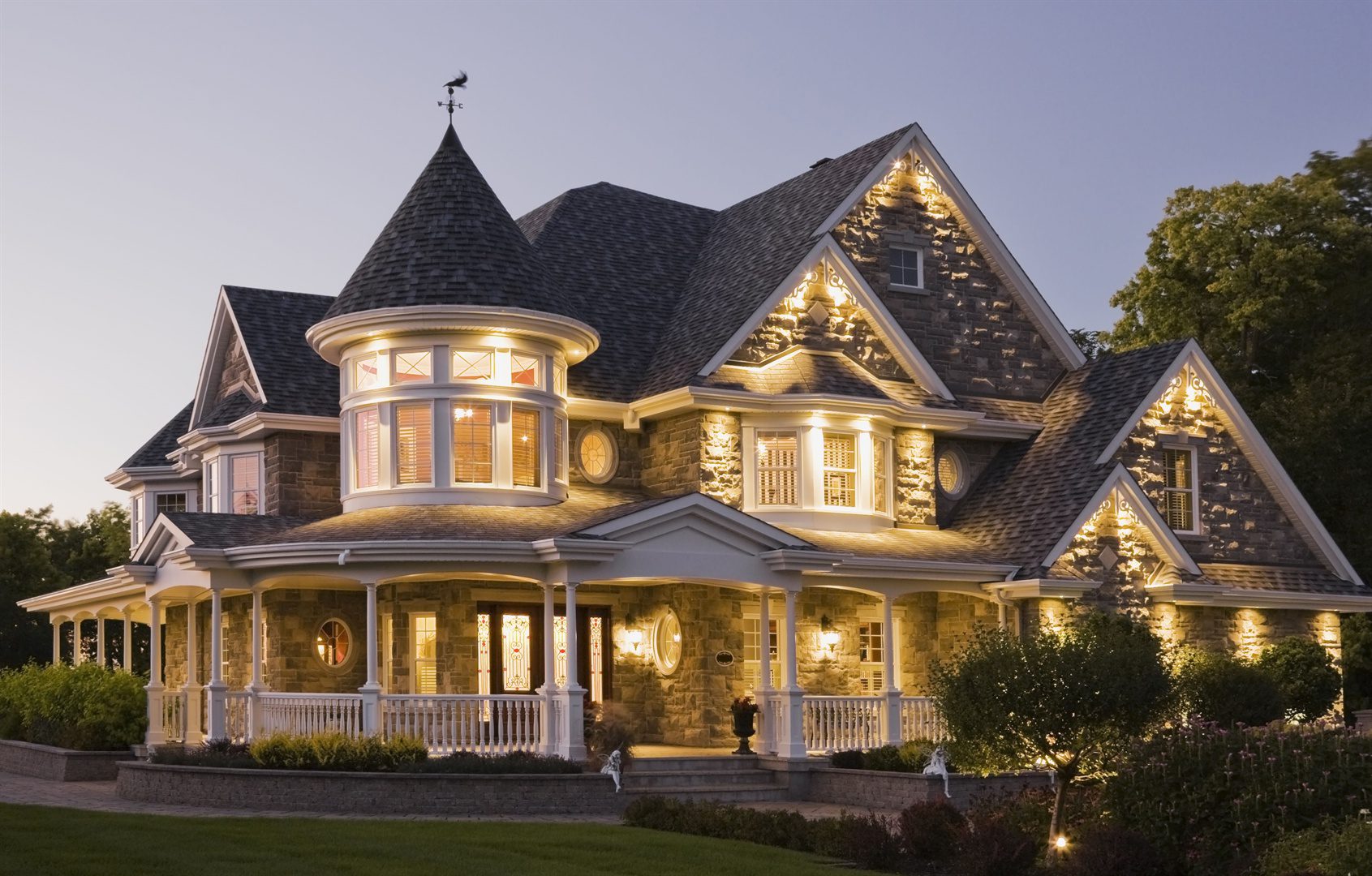 elegant-grey-stone-house-with-white-trim-and-blue