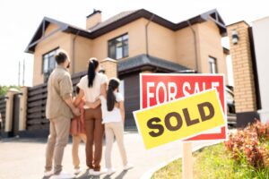 family-looking-at-new-house