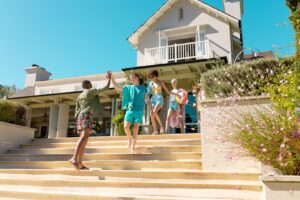 happy-diverse-group-of-friends-leaving-the-house