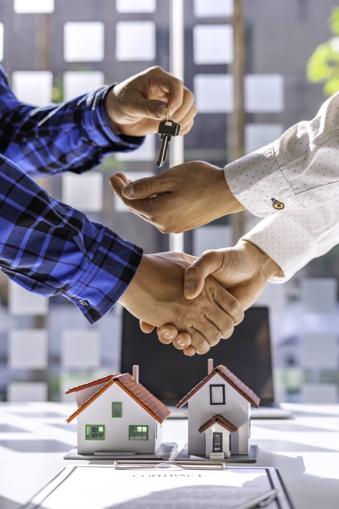 real-estate-agents-and-clients-shake-hands