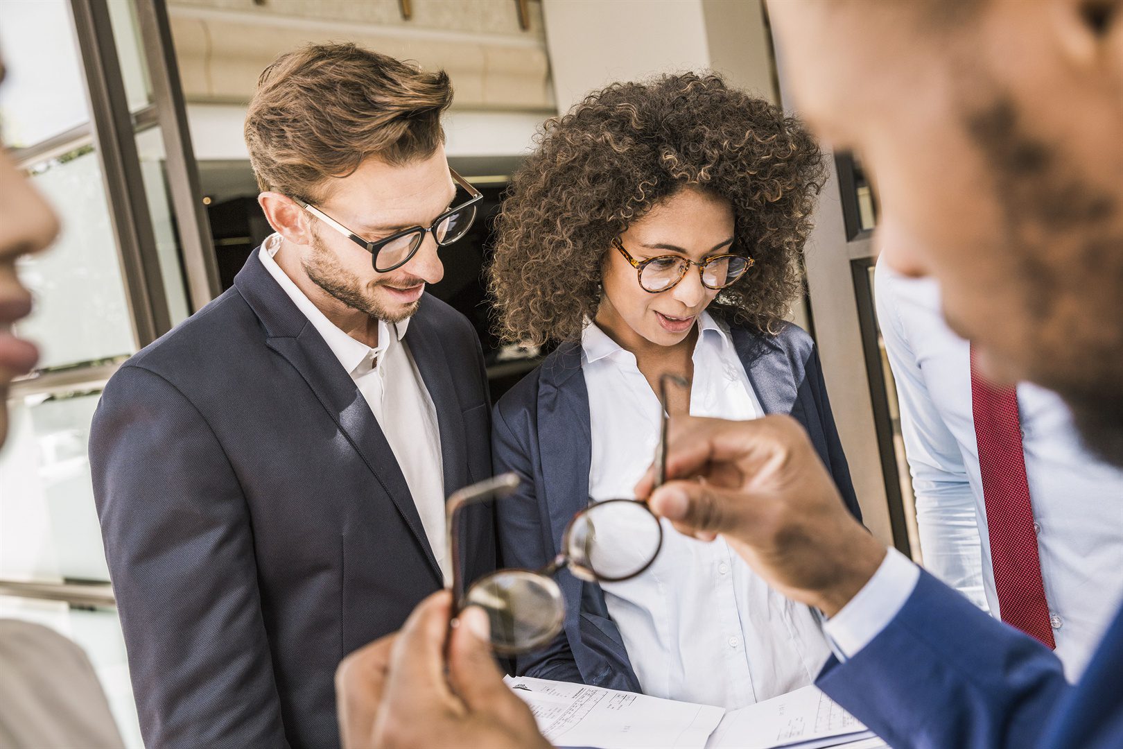 businessmen-and-businesswomen-preparing-paperwork