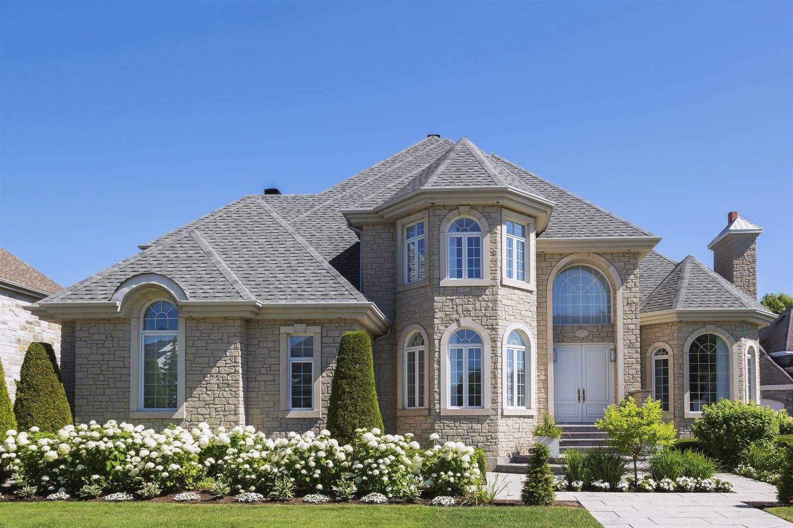 facade-of-luxurious-house-in-beige-stone