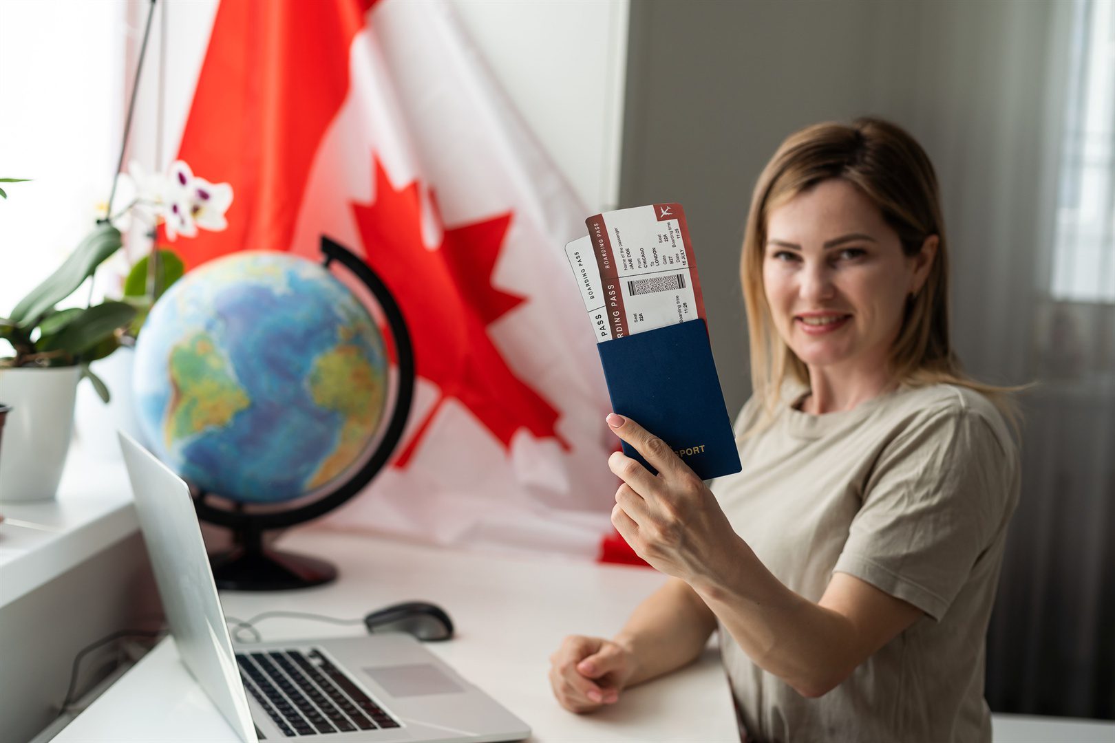 female-student-sitting-with-canadian-flag