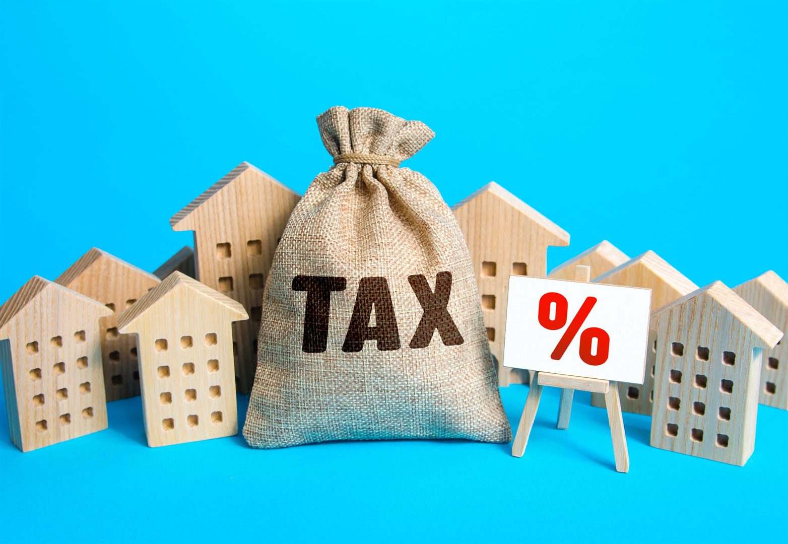 houses-and-a-bag-of-taxes-real-estate-tax