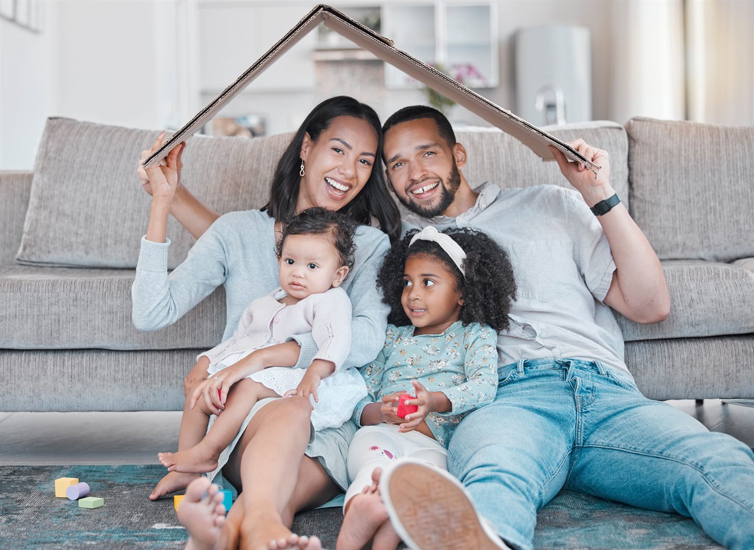 happy-family-new-house-and-cardboard-roof