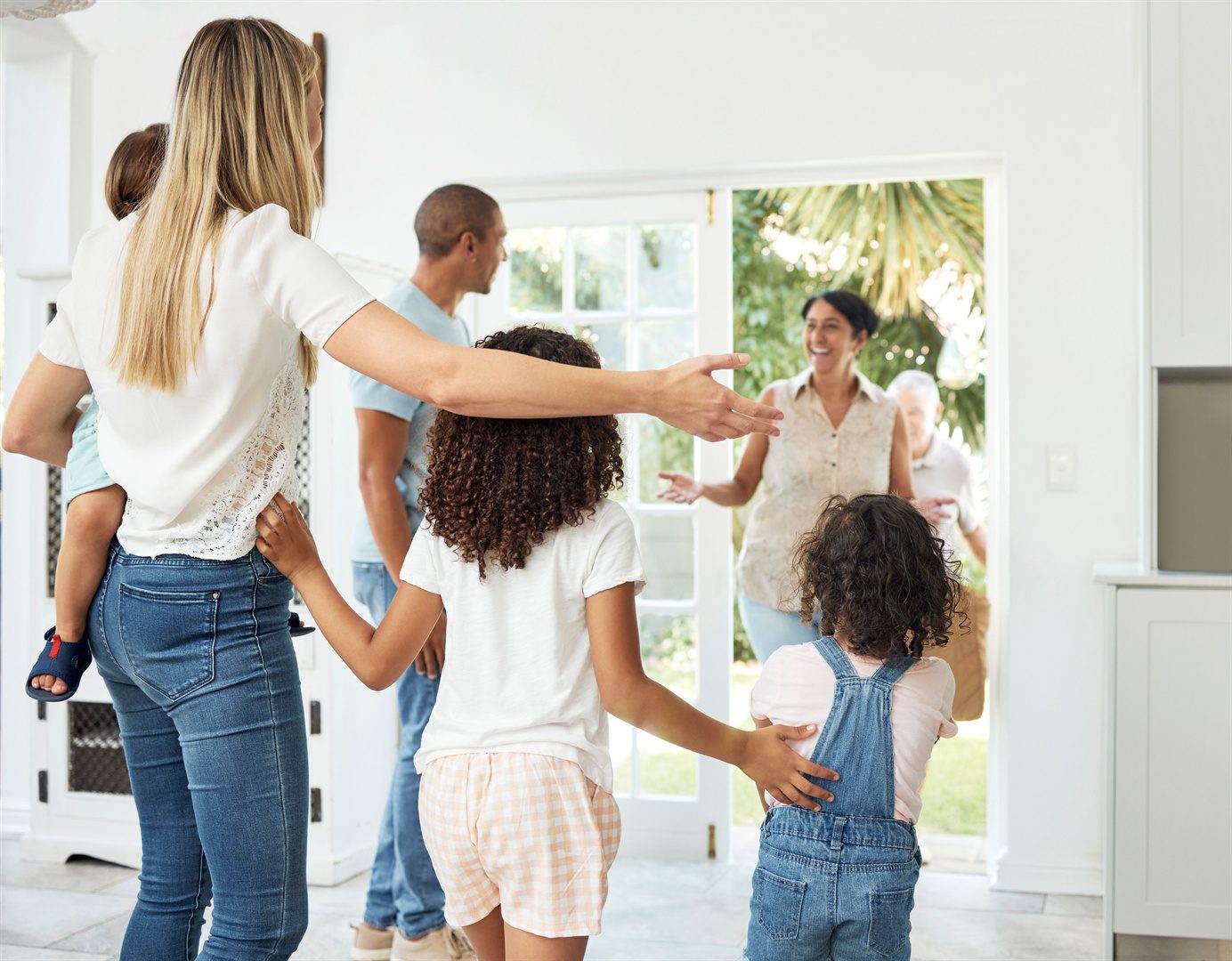 happy-home-and-family-welcome-grandparents-by-door